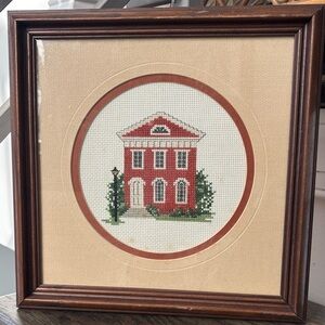 Embroidered 19th/20th century brick house, matted, framed. 29x19”